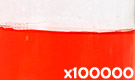 「食用赤色40号 アルラレッドAC」の水溶希釈例（100000倍）